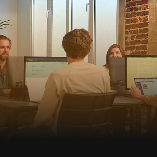 Analytics team working through performance data at their desks