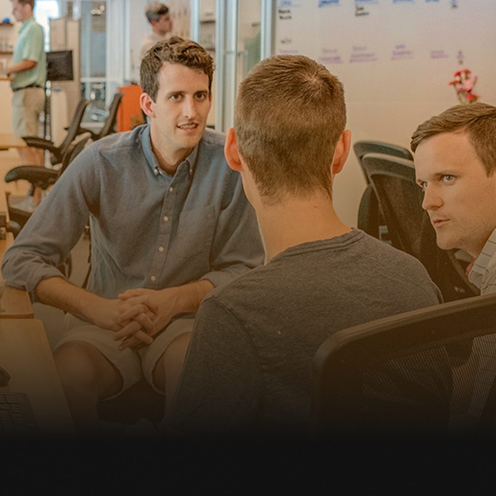 Data specialists discussing a tracking setup