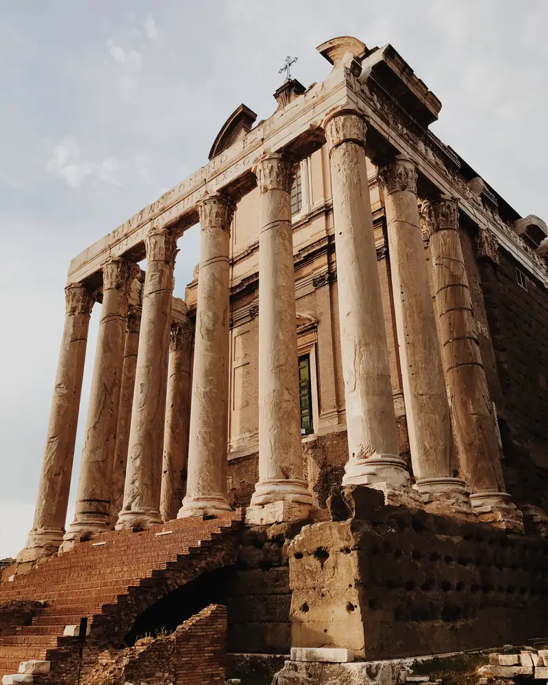 Columns of an ancient Roman temple in warm evening light